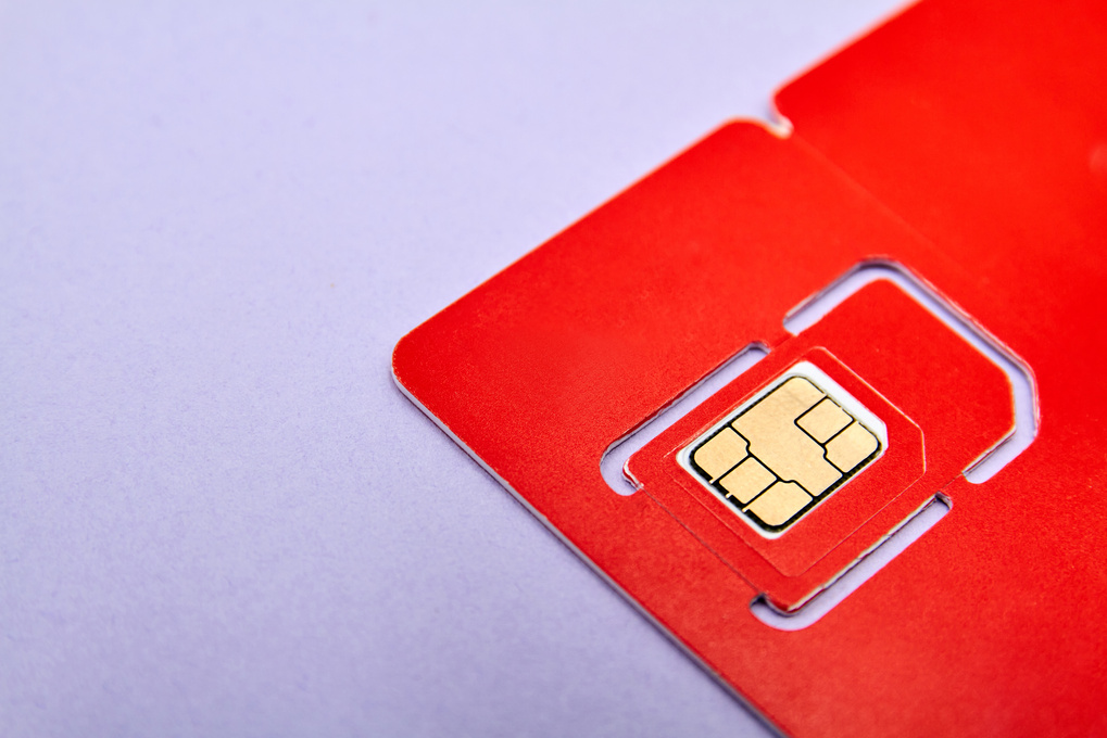 Sim Card for Mobile Phone on Purple Background.